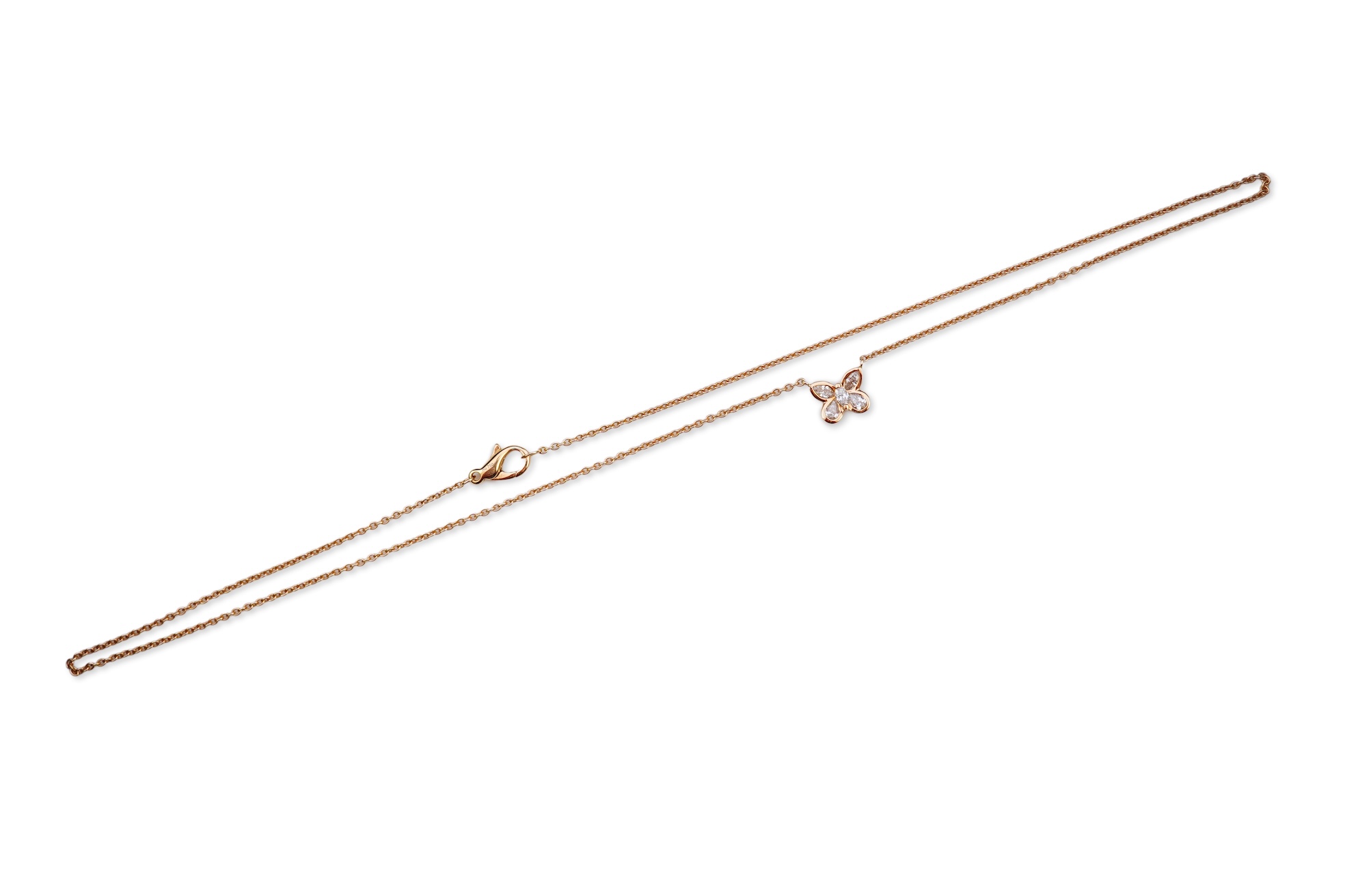 A gold and diamond pendant necklace